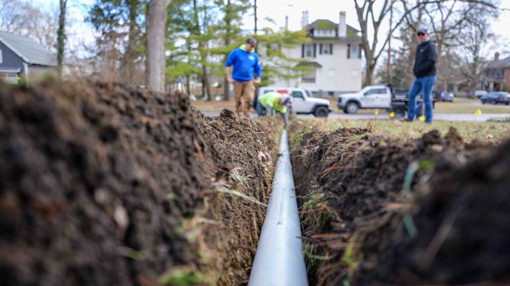 Pro Gutter Installing Drainage Pipe